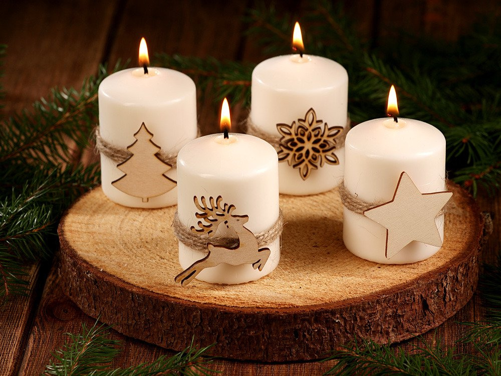 Christmas candle Candle with a Christmas tree on natural wood