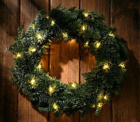 A wreath of artificial spruce decorated with LED lights diameter 30 cm