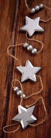 Garland of silver stars (4.5cm) on string 150cm